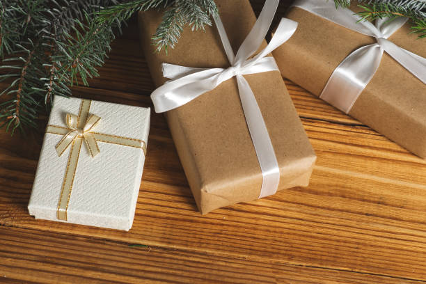 istock Christmas gifts on wooden table 1066982164