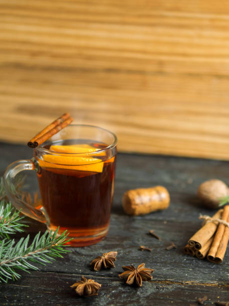istock Hot winter drink mulled wine on dark wooden table 1066982192
