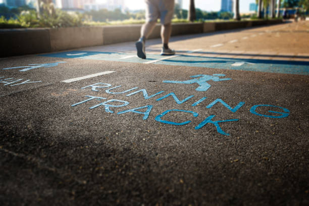 A runner running on running track in the park.