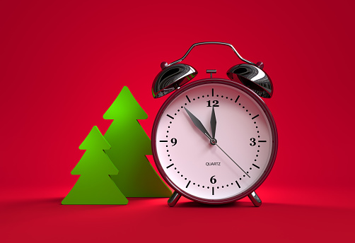 Christmas trees and alarm clock on red background -  five minutes to twelve - 3d illustration rendering