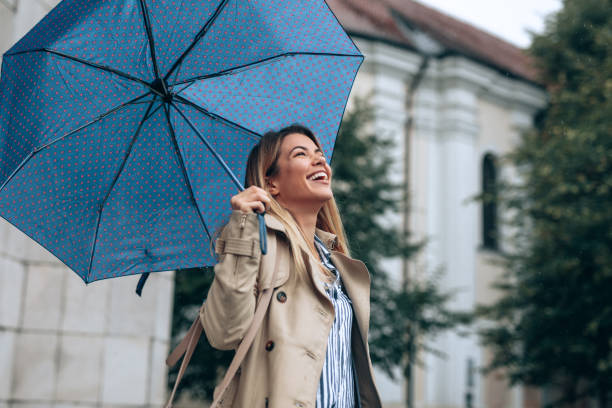 istock Young woman enjoying the rain 1066987770