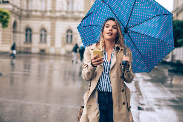 istock Young woman enjoying the rain 1066987784