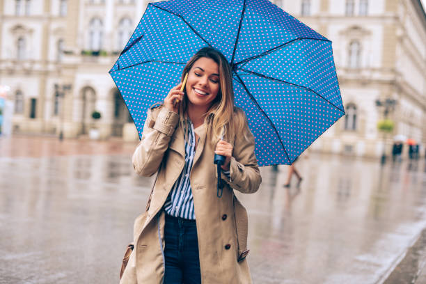 istock Happy woman on a rainy day 1066987794