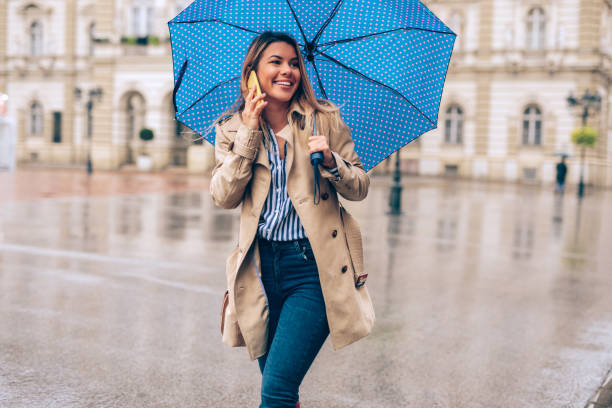 istock Young woman enjoying the rain 1066987796