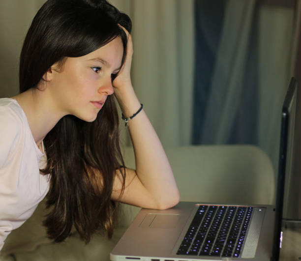 istock Teen girl using laptop computer 1066991054