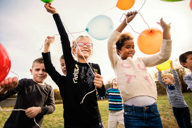 istock Cheerful kids playing with balloon's 1066993038