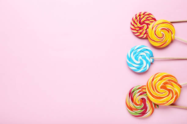 istock Colorful lollipops on pink background 1066993264