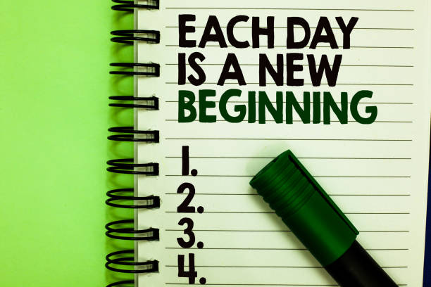 istock Handwriting text Each Day Is A New Beginning. Concept meaning Every morning you can start again Inspiration Written letters and numbers on notepad laid green marker green back. 1066994990