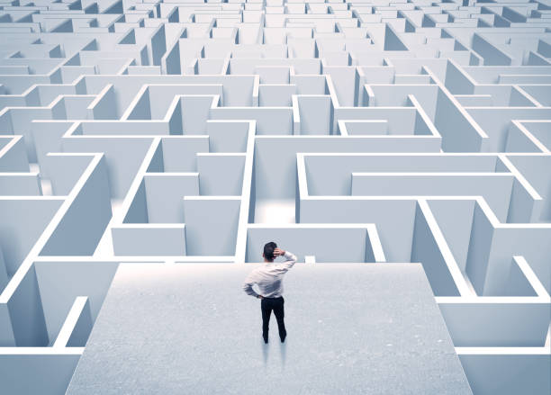 istock Businessman staring at infinite maze 1066996542