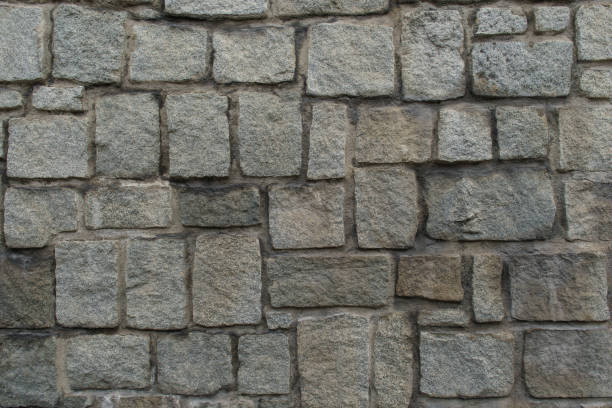 istock Texture of the granite stone wall for background 1066998340