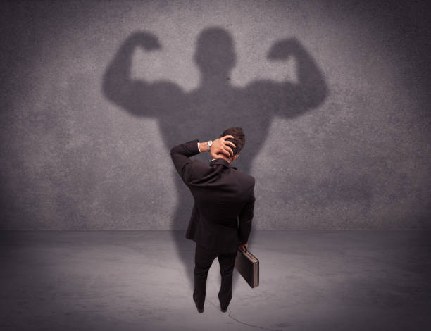 istock Successful businessman with strong shadow 1066998506