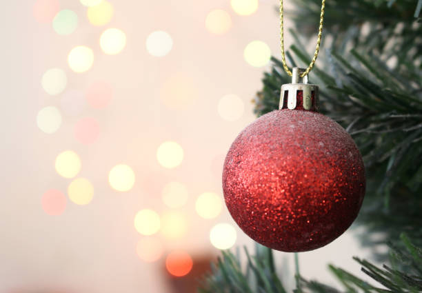 istock christmas tree with decorations ball gift with light bokeh background 1067000118