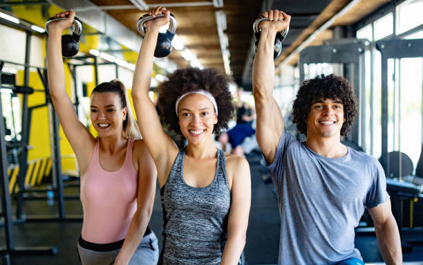 istock Healthy young athletes doing exercises at fitness studio. 1067002110