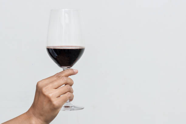 istock Hand holding a glass of wine 1067002142