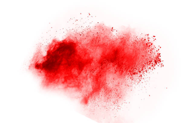 istock Freeze motion of red powder exploding, isolated on white background. Abstract design of red dust cloud. Particles explosion screen saver, wallpaper 1067003774