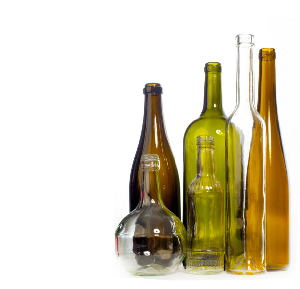 istock Background pattern, texture. Empty bottles of studio photography. Glass bottles of mixed colors, including green, transparent white, brown and blue. Group of bottles 1067003948