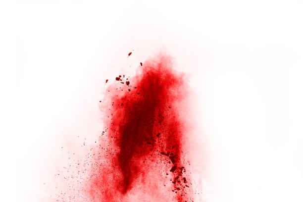 istock Freeze motion of red powder exploding, isolated on white background. Abstract design of red dust cloud. Particles explosion screen saver, wallpaper 1067004682