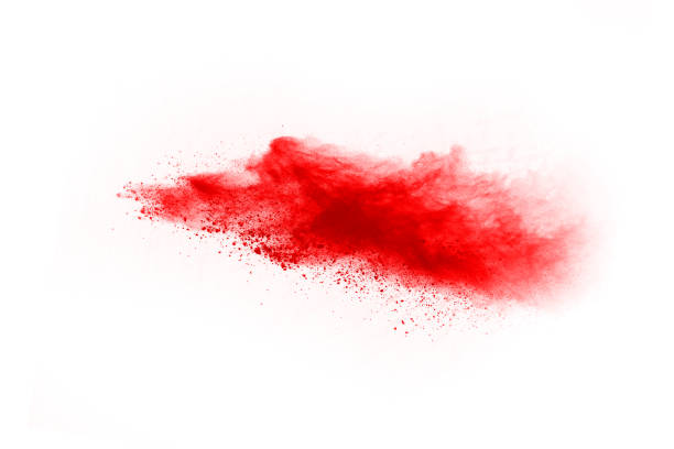 istock Freeze motion of red powder exploding, isolated on white background. Abstract design of red dust cloud. Particles explosion screen saver, wallpaper 1067007456
