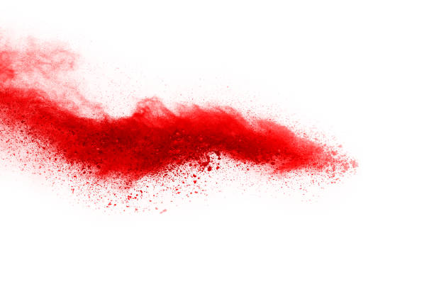 istock Freeze motion of red powder exploding, isolated on white background. Abstract design of red dust cloud. Particles explosion screen saver, wallpaper 1067007458