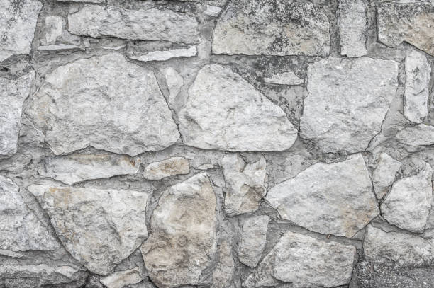 텍스처, 배경, 패턴입니다. 오래 된 화강암 돌입니다. 오래 된 돌 벽입니다. 돌의 짜임새입니다. 오래 된 회색 돌과 사암 질감 배경에서 벽돌 벽. - 18797 뉴스 사진 이미지