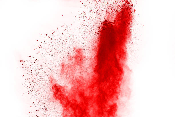 istock Freeze motion of red powder exploding, isolated on white background. Abstract design of red dust cloud. Particles explosion screen saver, wallpaper 1067007542