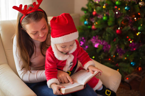 istock Mom reading a book to a baby son 1067007826