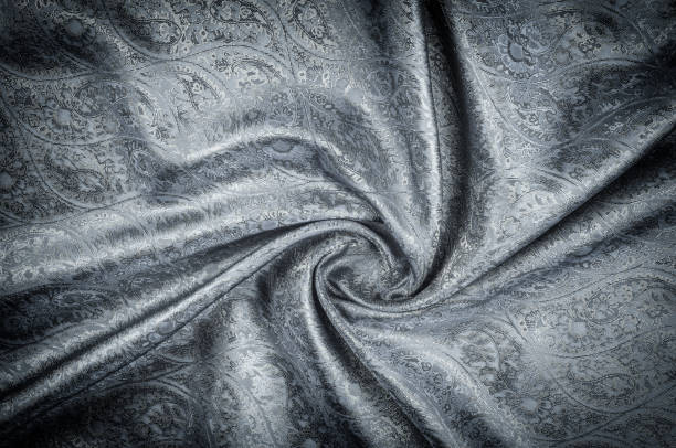 istock Background texture, pattern. Gray Paisley Silk Jacquard is an intricately woven shiny fabric with a tonal design woven in. The weave creates the effect of a 'shadow' pattern or print. 1067008144