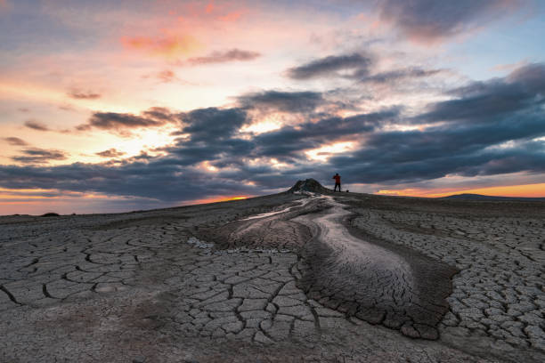 istock Mud volcanoes at sunset, beautiful amazing sky 1067008380