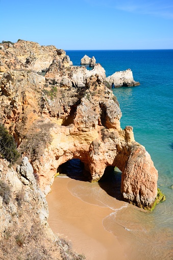 Tranquila playa y acantilados de Praia da Rocha, Portimao, Portugal. photo