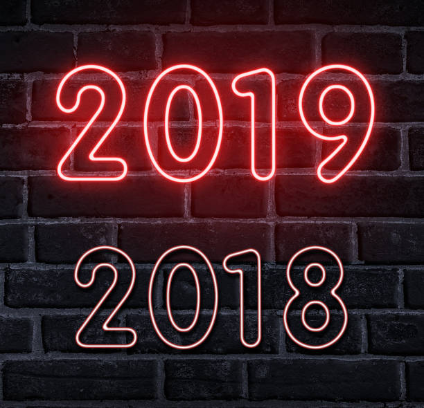 istock Hello New Year. Neon glowing 2019 on wall 1067019820