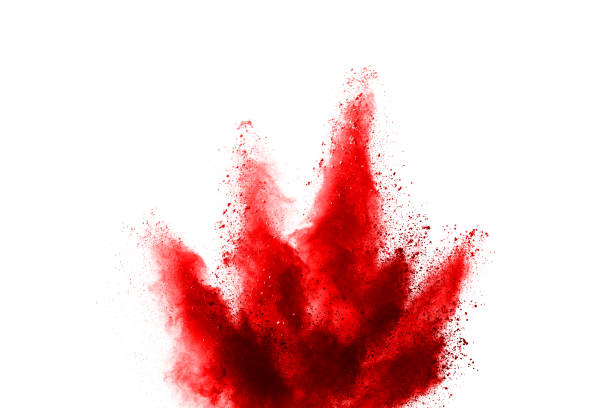istock Freeze motion of red powder exploding, isolated on white background. Abstract design of red dust cloud. Particles explosion screen saver, wallpaper 1067021900