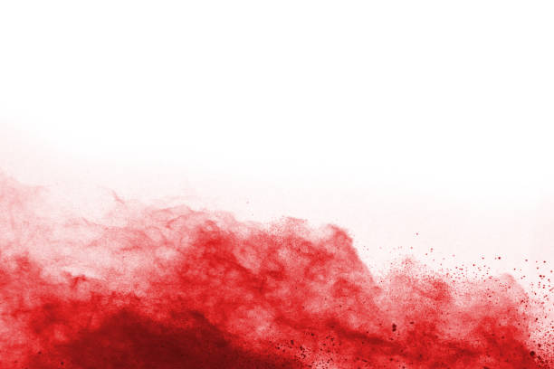 istock Freeze motion of red powder exploding, isolated on white background. Abstract design of red dust cloud. Particles explosion screen saver, wallpaper 1067022084