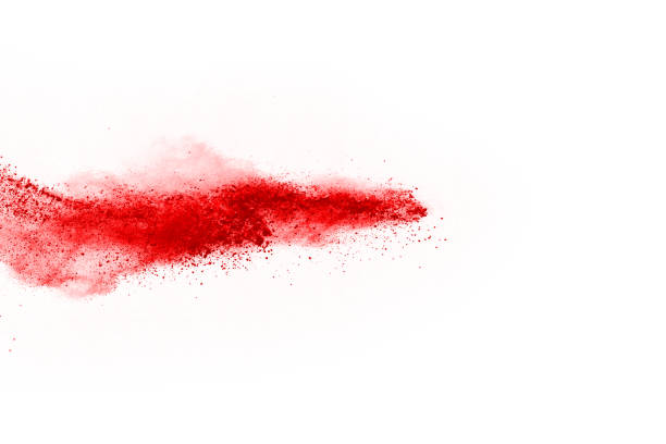 istock Freeze motion of red powder exploding, isolated on white background. Abstract design of red dust cloud. Particles explosion screen saver, wallpaper 1067022540