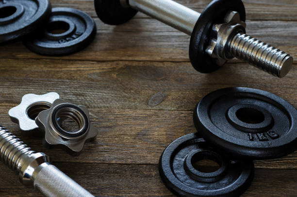 istock dumbbells gymnastic on a wooden background  4 1067031784