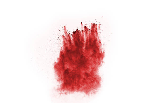 istock Freeze motion of red powder exploding, isolated on white background. Abstract design of red dust cloud. Particles explosion screen saver, wallpaper 1067038388