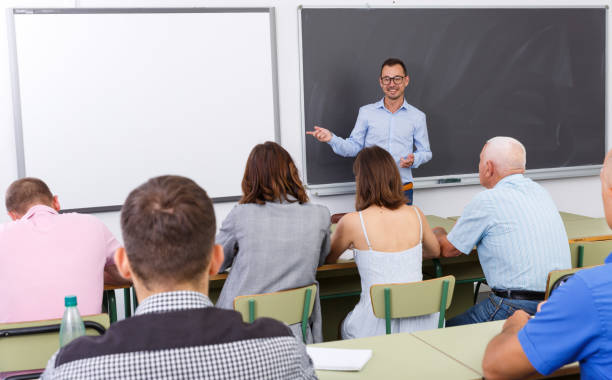 istock Young lecturer talking to mixed age  students 1067040208
