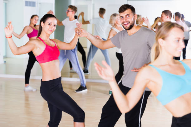 istock dancing couples of men and women learning swing 1067040438