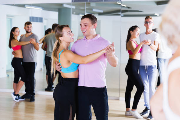 istock smiling young adults dancing salsa 1067040446