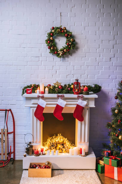 istock Fireplace with decorations near Christmas tree at home 1067040664