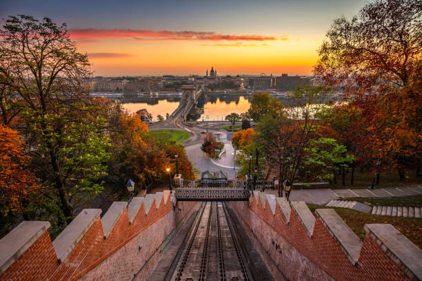 Budapest, Hungary - Autumn in Budapest. The Castle Hill Funicular (Budavári Siklo) with the Szechenyi Chain Bridge and St. Stephen's Basilica stock photo
