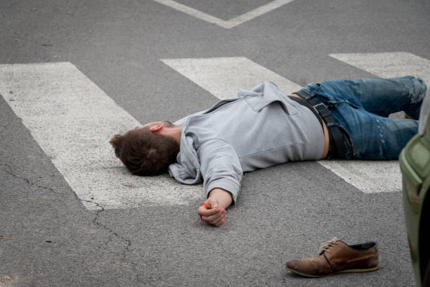 istock Traffic accident. Young man hit by a car 1067041352