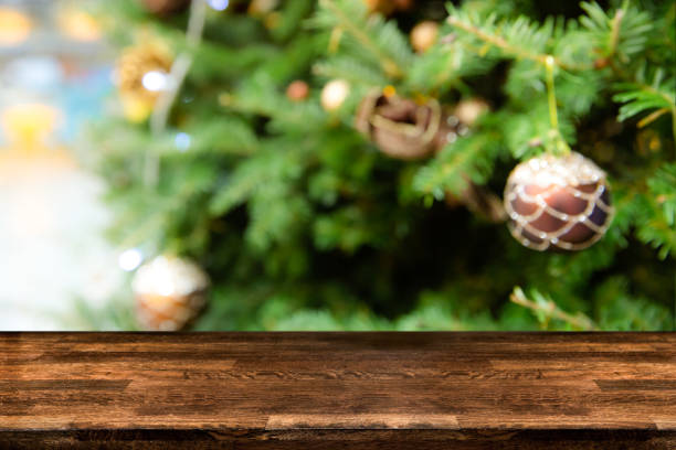 istock Blurred abstract of Christmas tree decorated with bauble balls hanging, light and small gift box. 1067041784