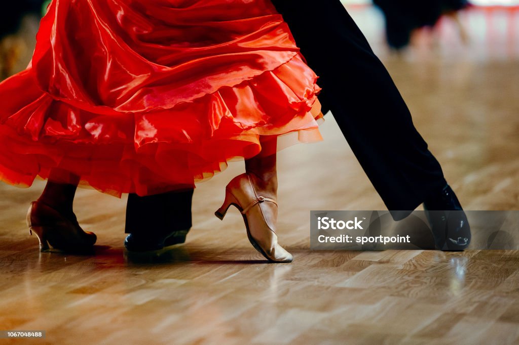 dance sports couple red dress black suit tail Dancing Stock Photo