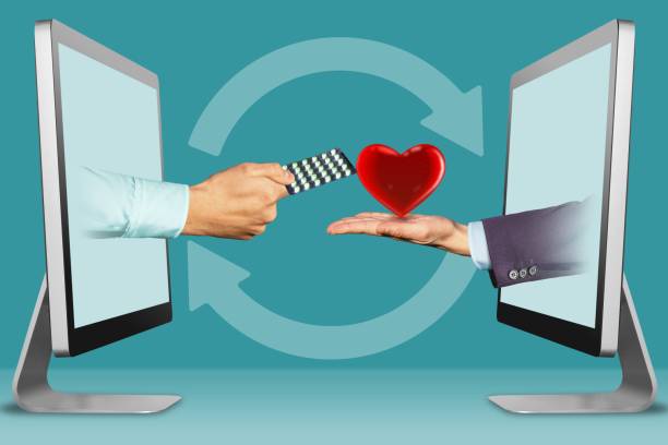 istock commerce concept, two hands from computers. hand with medicine pills  and heart. 3d illustration 1067051980