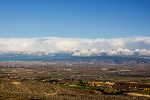 Late autumn view of the valley that holds the cities of Ellensburg and Kittitas from the Manastash Ridge view point on Highway 82 in Washington State.