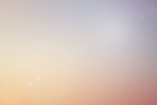 abstract blur pastel color tone sky background with shine glow light effect for design as banner , ads concept - focagem difusa imagens e fotografias de stock