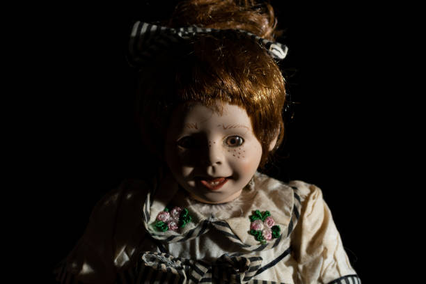istock Creepy doll, black background 1067057816