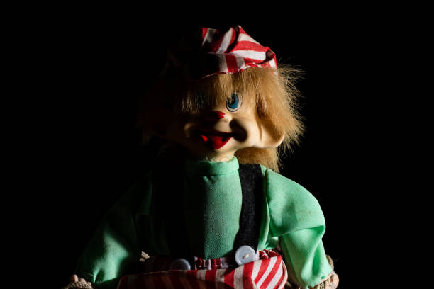 istock Creepy doll, black background 1067057844