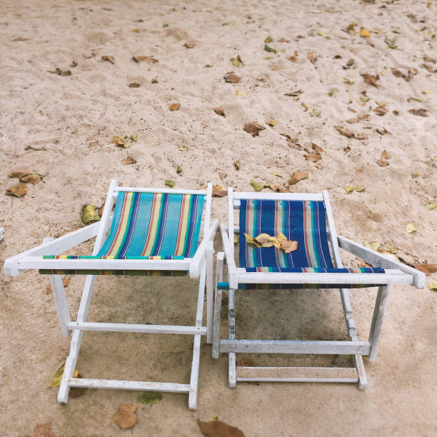istock Two empty deck chairs on the beach, Summer holiday concept 1067060814