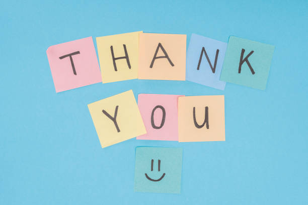 istock colorful sticky notes spelling thank you isolated on blue background 1067061250
